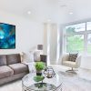 Forest Alchemy abstract forest painting by Andy Taylor staged in a living room